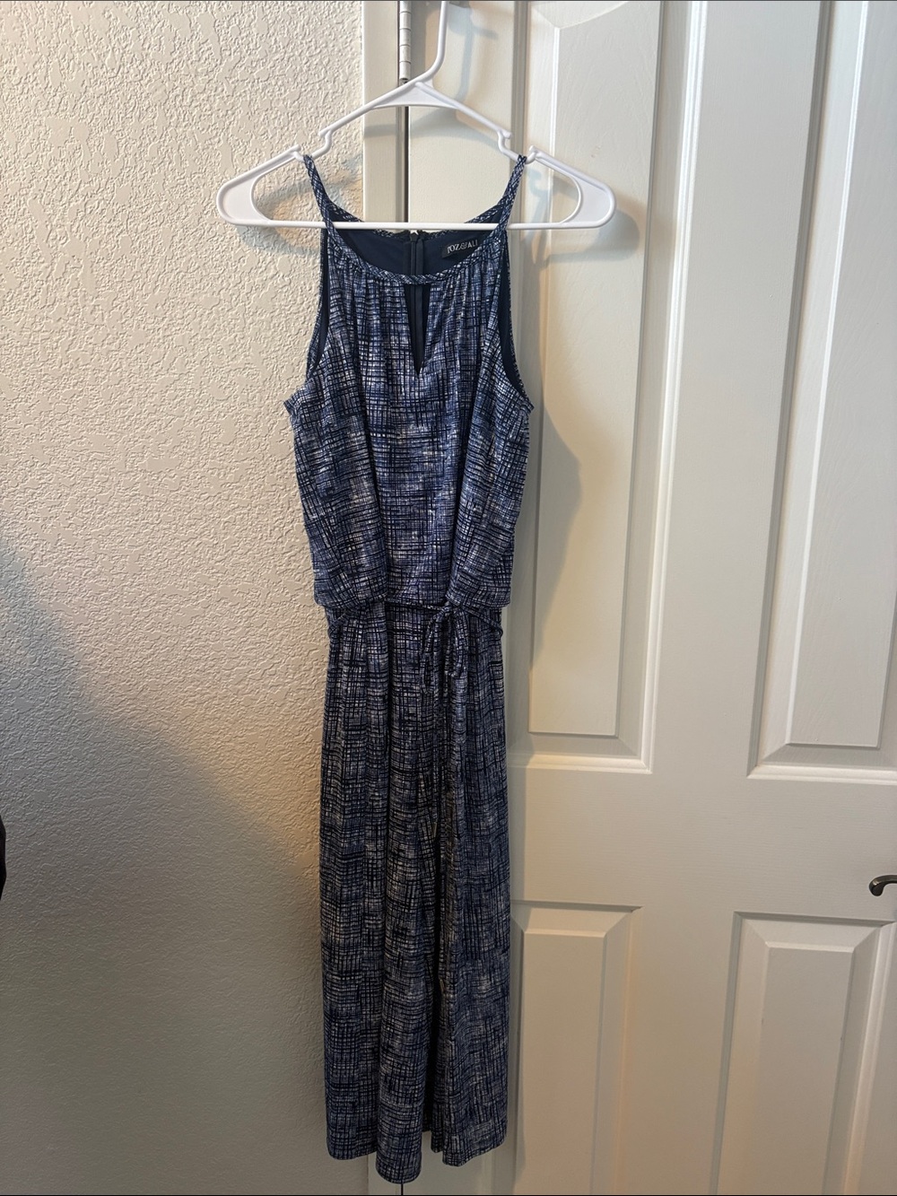 Sleeveless Navy Patterned Jumpsuit with Tie Waist